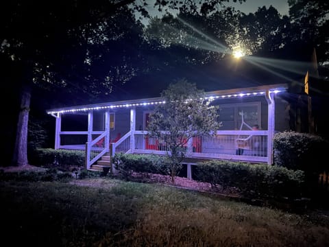 The front of the cabin is lit with permanent holiday lights. 