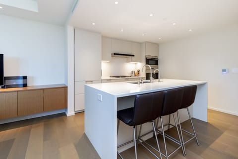 Kitchen - Elegant kitchen comes fully-equipped for all your cooking needs. Eat-in counter top that seats three.