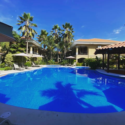 Pool area with main pool for adults, one pool for kids, and a jacuzzi