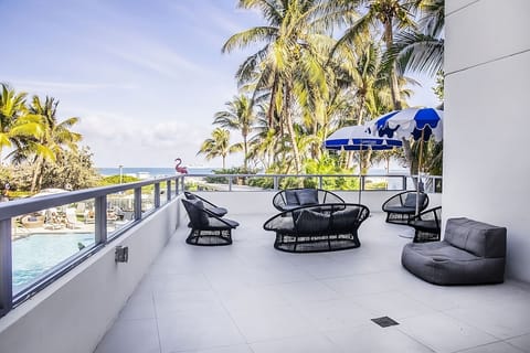 Lounge in the sun with palm views and coastal vibes.