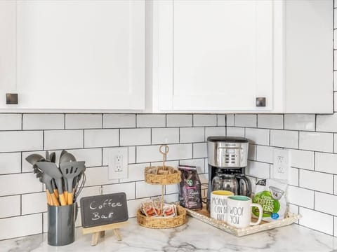 Find an array of cooking utensils on the counter.