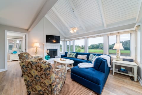 Enjoy the stunning view of the pond and the 11th fairway and/or being entertained from the large flat-screen smart television.