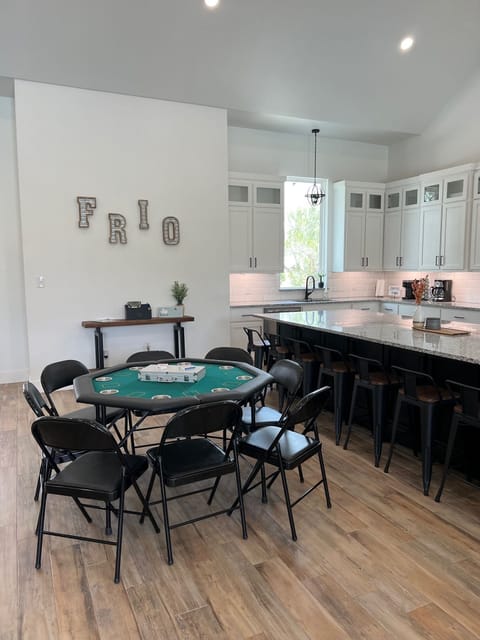Poker table complete with cards and chips for a late night game.
