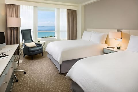 Stretch out in crisp beds with calming skyline views