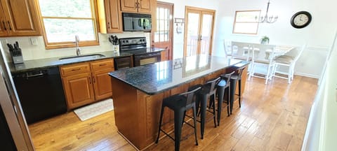 Fully furnished kitchen with seating for 10. 