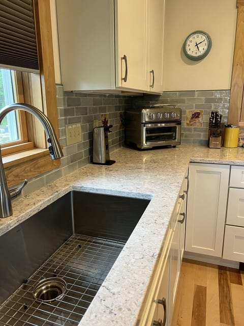 Large stainless steel sink, gorgeous quartz countertops!