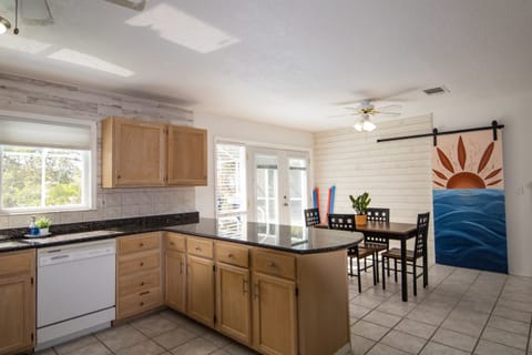 Kitchen with access to the lanai, and a view of the water.