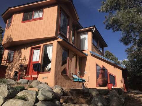 Back of Home.  Hot tub with awesome sunset views