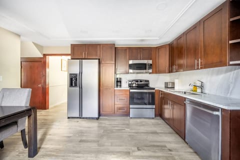 Fully equipped kitchen and cozy dining area for easy meals and gatherings."