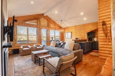 Living Room with Plush Furnishings, Sleeper Sofa, 55" Smart TV with Cable, and Gas Fireplace