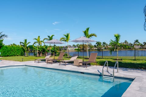 Welcome to "The Palm View House" and it's amazing backyard with heated pool!
