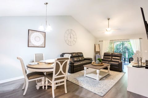 Dining and living room with tv