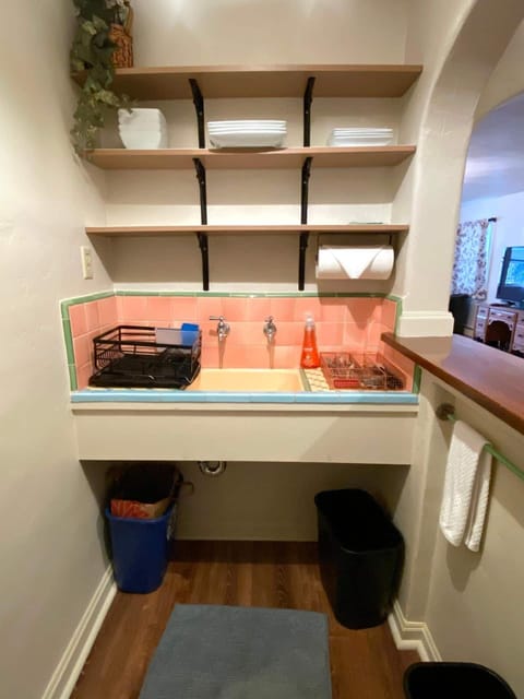 Kitchenette with sink, silverware and dishes...