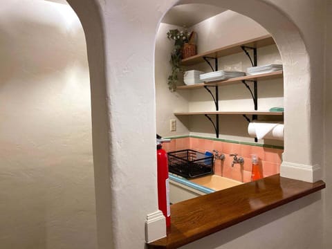 Kitchenette with sink, silverware and dishes...