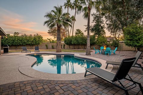 Lovely Arizona backyard with lounging areas and a beautiful pool.