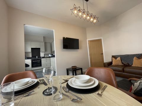 The dining table is positioned next to the window so you can enjoy the view whilst tucking in to a delicious meal.