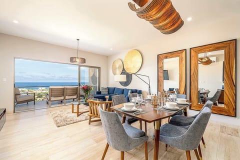 Open-concept living room with cozy seating and inviting decor.