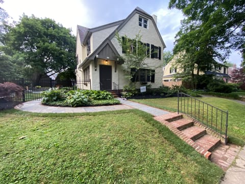 Front yard walkway leading past side yard and back patio to private Studio 