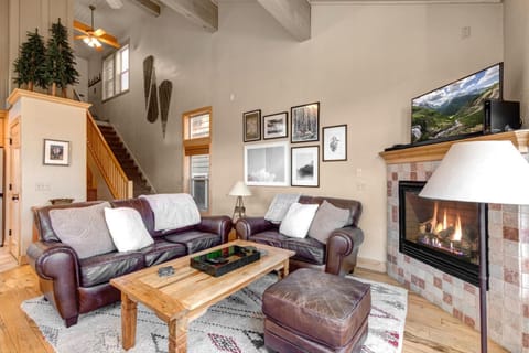 Gather in your main living area with a gas fireplace, vaulted ceilings, and cozy seating. Perfect after mountain adventures.