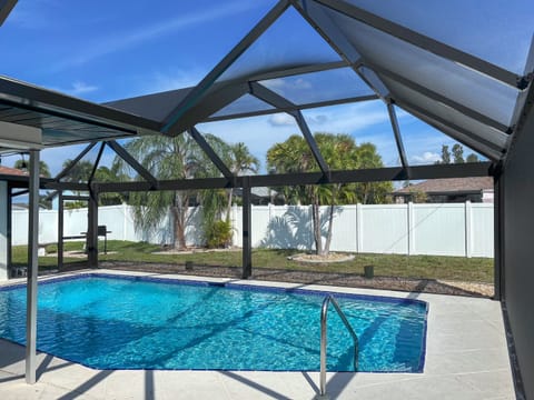 Brand new (MARCH 2024) panoramic style pool cage screened-in lanai! 
