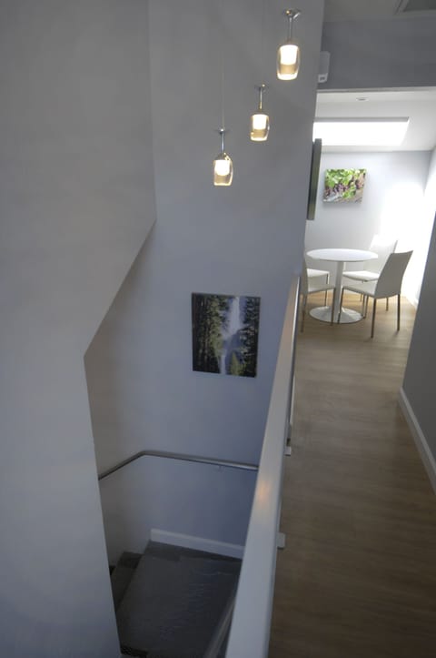 Photo of stairwell and hallway that take you up to the loft.