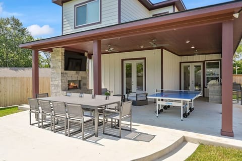 Expansive outdoor dining area offers ample seating for delightful gatherings.
