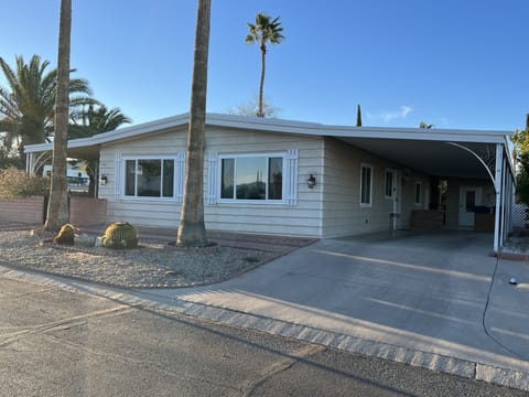 Carport is deep enough for two cars. 