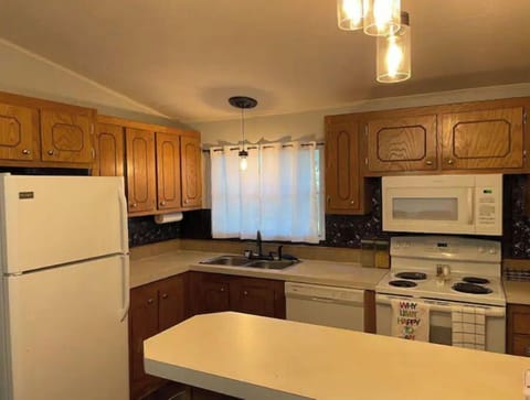 Kitchen with updated appliances. Fully furnished with dishes, pots/pans, blender