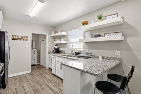 Kitchenwhite cabinetRefrigeratorsitting area