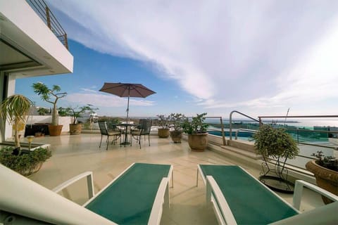 Unwind on your private terrace with a pool, loungers and ocean views.

