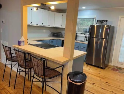 Bar seating for three and trashcan