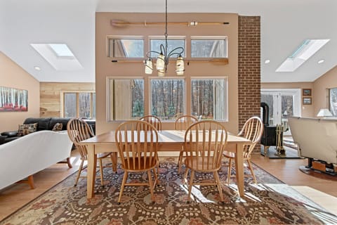 Dining Room with cherry table, seating for 8 people.  View of back yard & deck.