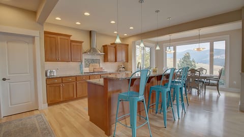 Huge kitchen with an island bar, coffee bar, gas stove and all of the amenities