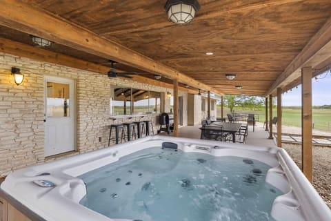 [Patio] Covered patio with hot tub, BBQ, outdoor dining & lounge area