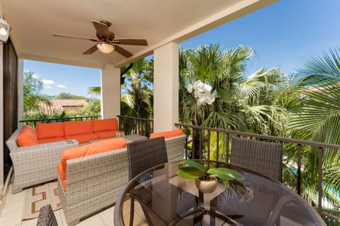 Private balcony overlooking pools. Spacious outdoor entertaining & dining area.
