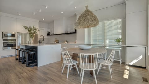 Dining table, kitchen island and window stools for plenty of seating