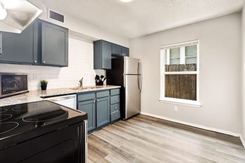 Spacious full size kitchen with new appliances.