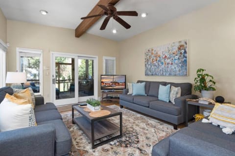 Gather around the flatscreen TV in the sunken den located between the kitchen and screened-in porch.