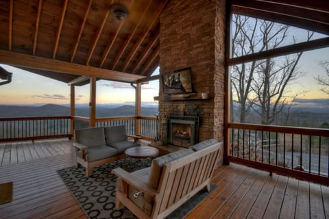 Covered Deck with Cozy Fireplace and Flat Screen TV.