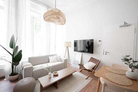 Relax in our bright living space, where comfort meets chic design.