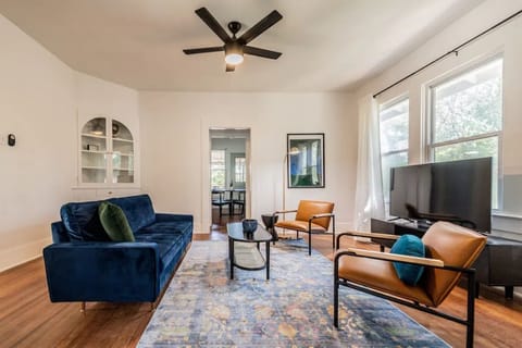 Living room with 50in Roku Smart TV, games and puzzles for all ages