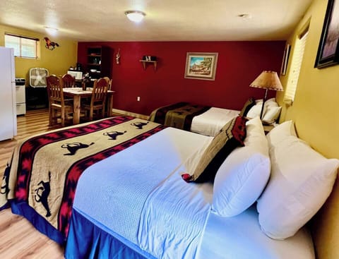 Two queen beds, dining table, full kitchen