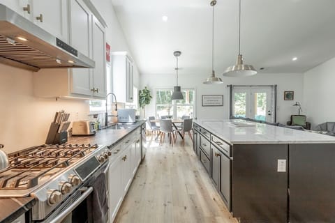 open concept kitchen, living room, and dining