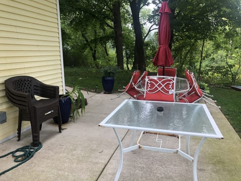 Back patio with 2 tables and chairs