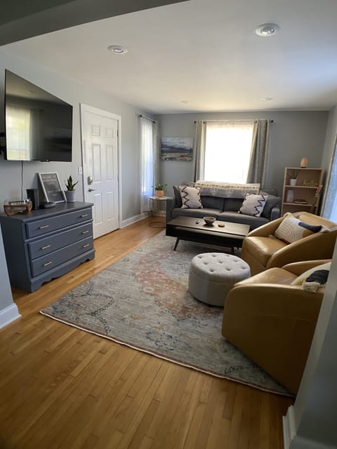 living room with a 55" smart tv, loaded with popular streaming services