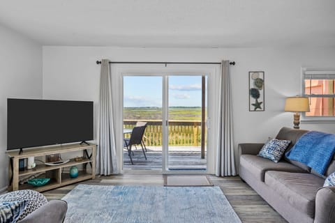 Enjoy watching gorgeous sunsets or your favorite TV show in our living room.