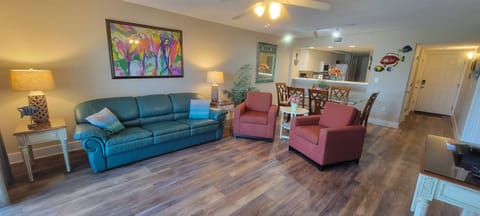 Living room with queen pull-out sofa bed and 55" Roku 4K smart tv