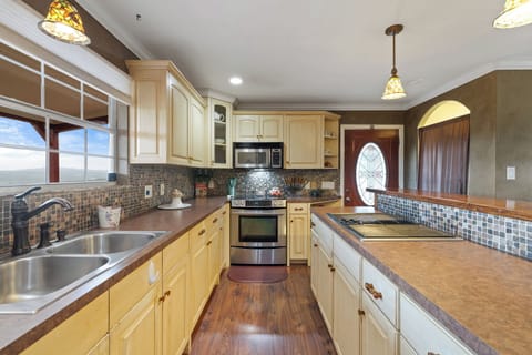 kitchen range barbeque grill with large scenic hillview window