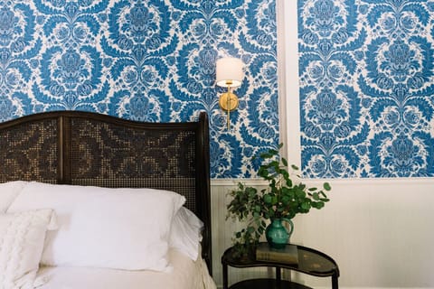 Master Bedroom with King bed, luxury linens, dimmable (from the bed) wall sconces, and wall-papered for the Gods