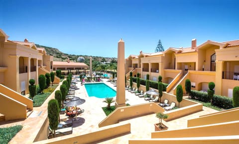 Main complex showing heated adult pool and sun loungers